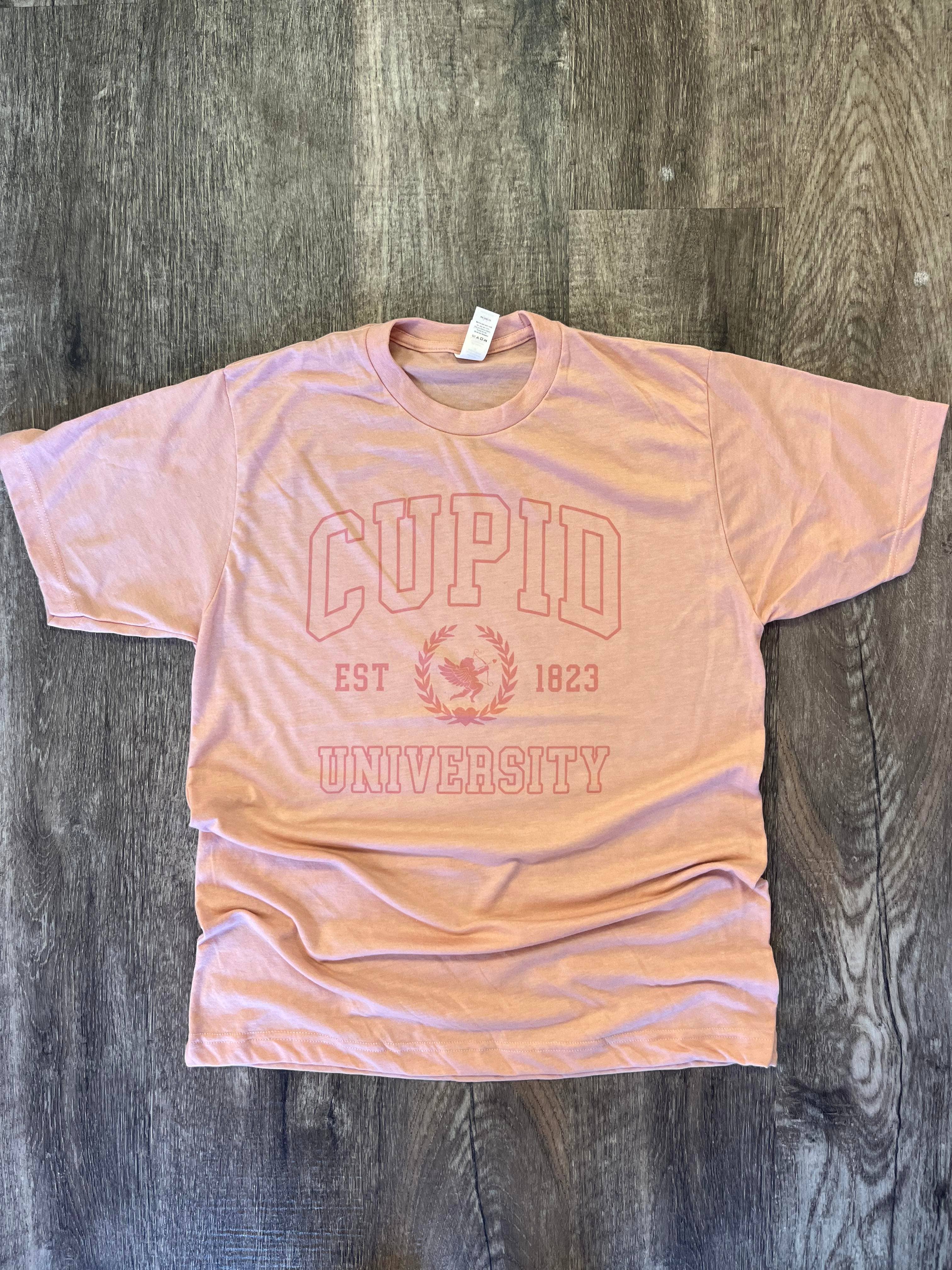 Cupid University Pink Print On Heather Peach - Adult & Kids T-Shirts, Sweatshirts & Hoodies apparel design preview 1