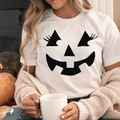 Pumpkin Face with Eyelashes Bella Canvas - Adult & Kids T-Shirts, Sweatshirts & Hoodies apparel design preview 1