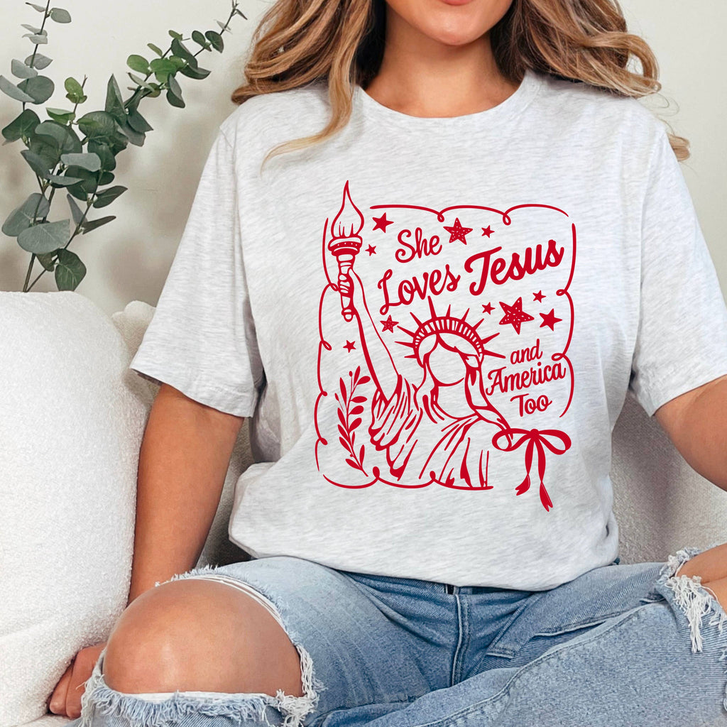 She Loves Jesus and America July 4th Graphic Gildan - Adult & Kids T-Shirts, Sweatshirts & Hoodies apparel design preview 1