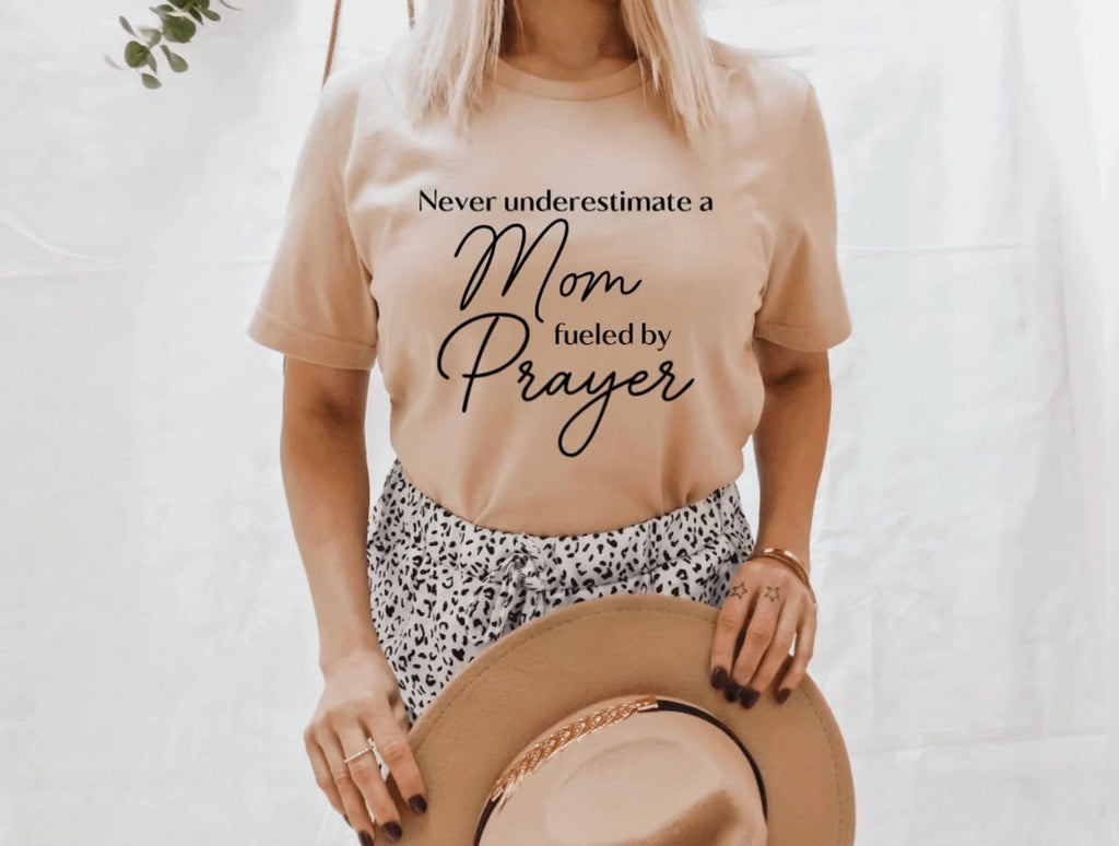 Never Underestimate A Mom Fueled By Prayer - Adult & Kids T-Shirts, Sweatshirts & Hoodies apparel design preview 1
