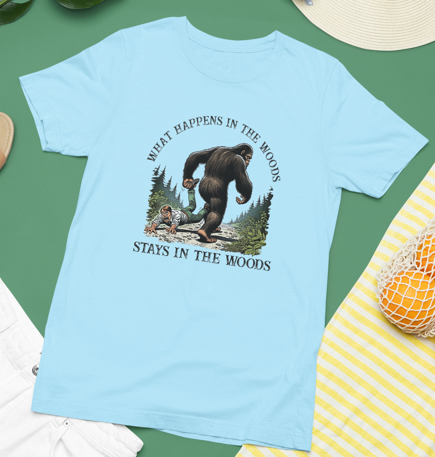 What Happens in the Woods... Bigfoot (Light Blue) - Adult & Kids T-Shirts, Sweatshirts & Hoodies apparel design preview 1
