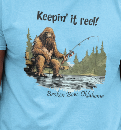 Bigfoot Fishing Keepin' It Reel W/Your Location - Adult & Kids T-Shirts, Sweatshirts & Hoodies apparel design preview 1