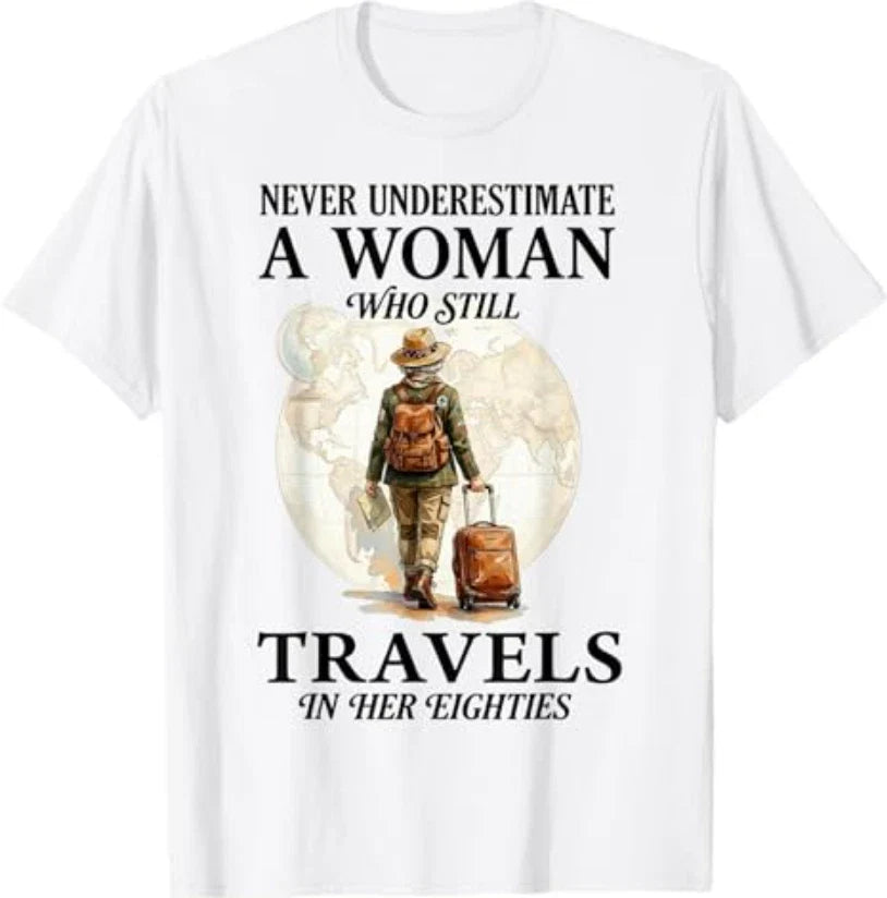 Never Underestimate a Woman who Still Travels in her - Adult & Kids T-Shirts, Sweatshirts & Hoodies apparel design preview 1
