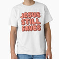 Jesus Still Saves Bold Christian Faith Statement by - Adult & Kids T-Shirts, Sweatshirts & Hoodies apparel design preview 1